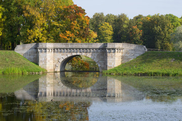 Naklejka premium The Karpin bridge closeup sunny september day. Gatchina Palace Park. Leningrad region, Russia