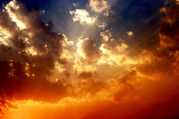 Sunset with clouds, light rays and other atmospheric effects.