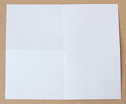 crumpled unfolded piece of white paper