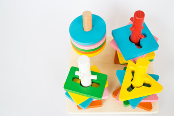 Colorful puzzle wooden toy on white table