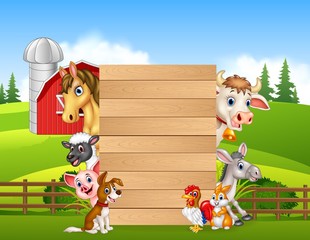 Cartoon happy farm animals holding wooden sign 
