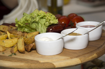 Fried potatoes, greens, tomatoes and different sauce