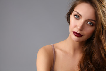 Portrait of beautiful woman , isolated on gray background