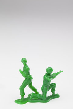 two green toy soldiers