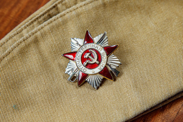 Order of the Patriotic War in St. on a Soldier's forage cap. Close up