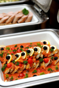 fried fish in tomato sauce with decoration