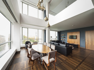 open plan living room of a luxury duplex apartment.panorama