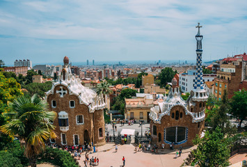 Fototapeta premium BARCELONA, SPAIN - JUNE 26: The famous Park Guell on June 26, 2014 in Barcelona, Spain. The impressive and famous park was designed by Antoni Gaudi.
