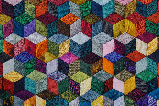 Fototapeta Colorful detail of quilt sewn from diamond pieces