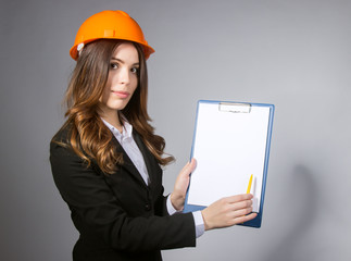 woman Builder writes in the Clipboard