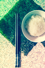 rice bowl with seaweed wakame and chopsticks