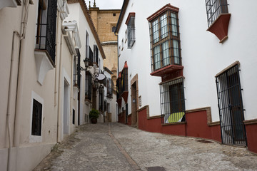 Narrow Street in Old Town of Ronda in Spain