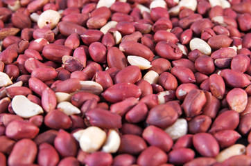 Many roasted red peanuts. Close up image