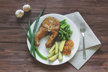 fried fish with potatoes and asparagus