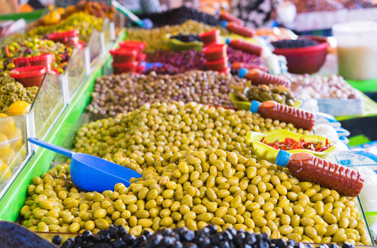 Market stall selling fresh olives in Agadir, Morocco.