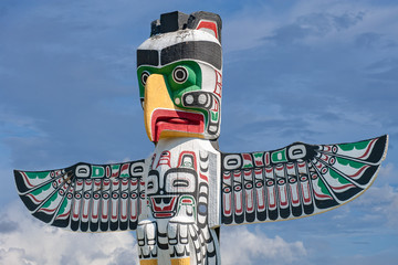 Totem wood pole in sky background