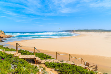 Wooden walkway to idyllic sandy Praia do Bordeira beach, Algarve region, Portugal