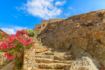 Fototapeta na wymiar Stone steps in old medieval village of Sant Antonino, Corsica island, France