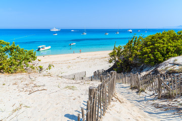 Path to Saleccia beach with white sand and azure sea water near Saint Florent, Corsica island, France