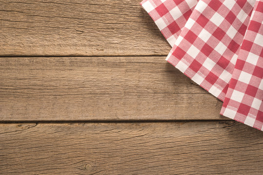    Tablecloth textile on wooden background 
