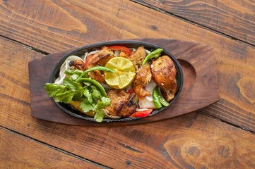 Wall murals meal dishes Food grilled chicken pieces on a dish