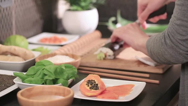 sushi roll process of making raw makki fresh seafood susi - stock image