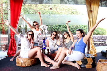 Funny girl smoking a hookah