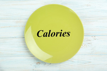 Green plate on a blue wooden table