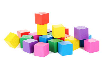 Colorful wooden toy cubes isolated on a white