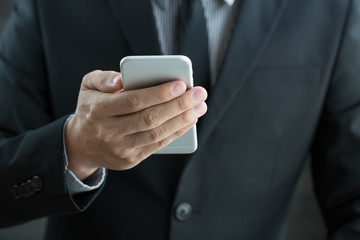Businessman using mobile smartphone