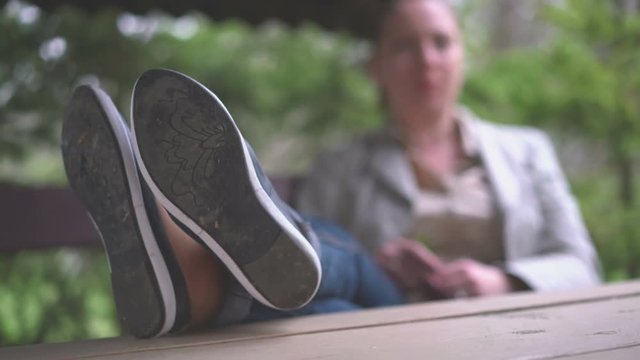 Woman relaxes in the park