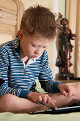 boy sitting at a tablet