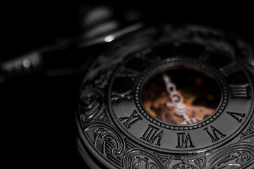 Pocket fob watch / antique pocket fob watch on black background