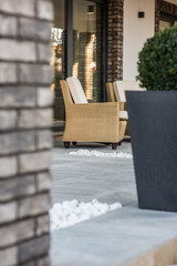 Armchairs on open terrace in luxury villa exterior