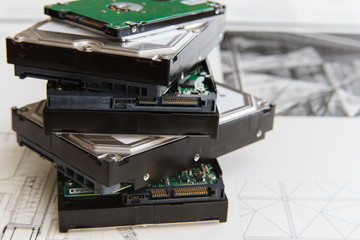 Fototapeta pile of  hard drives at white background obraz