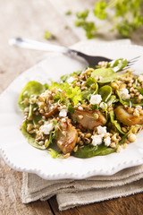 Warm salad with spinach, lentils, buckwheat and mushrooms