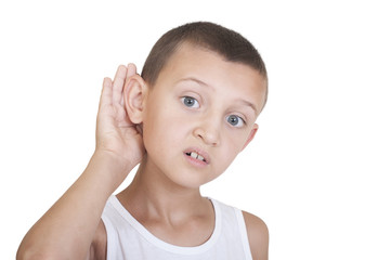 boy put his hand to his ear and listens