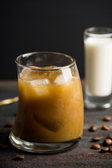 White russian cocktail on the wooden background