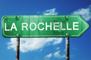 la rochelle road sign, vintage green with clouds background
