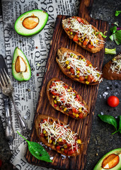 Bruschettas with tomatoe and avocado.