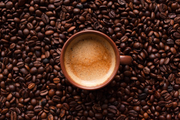 Coffee espresso on coffee beans background