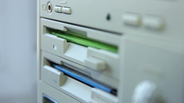 Inserting Diskette Into Retro Computer Timelapse