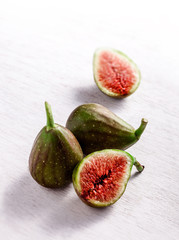Figs group on rustic white table and white background