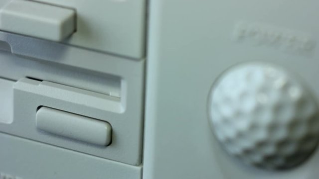 Inserting Diskette Into Retro Computer Timelapse