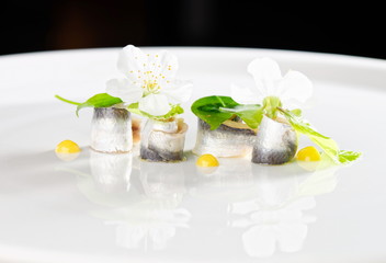 Fine dining seafood appetizer with Anchovies