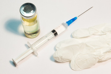 The syringe and ampoule on a white background