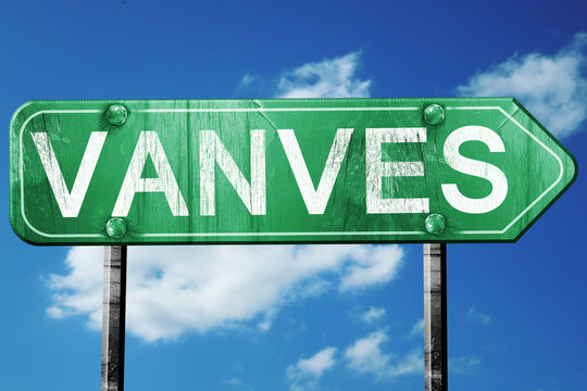 vanves road sign, vintage green with clouds background