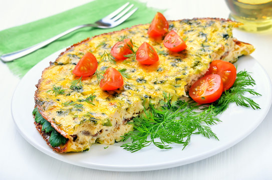 Omelet with herbs and vegetables on the plate