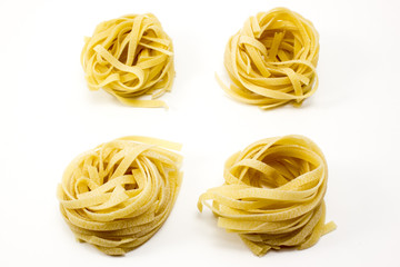 Pasta tagliatelle on a white background