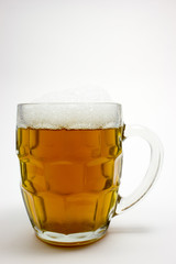 Mug of beer on white background